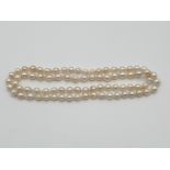 (NB) A double length cultured baroque pearl necklace, approx 76cm long.