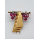 (NB) A vintage brooch set six rubies and four small diamonds, by Alabaster & Wilson, stamped 14ct