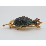 (NB) A 19th century yellow metal and enamel novelty beetle brooch, 45mm wide, gross weight 5g.