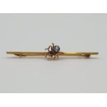 (NB) A 9ct gold spider bar brooch, set aquamarine body and amethyst head, hallmarked Chester 1921,