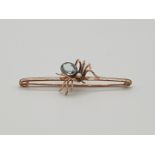 (NB) A late 19th/early 20th century yellow metal spider bar brooch, with aquamarine and pearl set