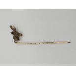 (NB) A late Victorian stickpin, having stags head terminal set with rose cut diamond eyes, 63mm.