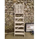 An old painted oak folding ladder.