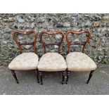 Three rosewood chairs, 86cm high.