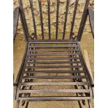 A black painted metal rocking chair.