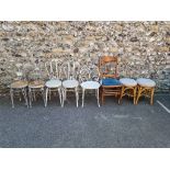 A quantity of metal garden chairs; together with a pair of bamboo stools and one other chair.