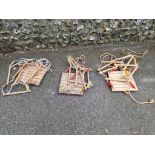 Three child's rope and wood swings.