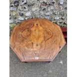 A late Victorian walnut hexagonal table, 66.5cm high x 74xm wide; together with a hanging cupboard.