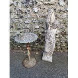 A reconstituted stone figure of a classical maid, 90cm high; together with a cast iron bird bath,