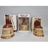 Three old decanters of Bell's blended whisky, comprising: two 75cl examples and another 37.5cl