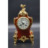 A late 19th century French tortoiseshell and brass mantel clock, 31.5cm high, with pendulum.