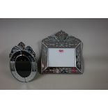 Two Venetian style mirrored glass photograph frames, aperture of largest 13 x 17.5cm.