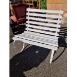 A small white painted bench, having wrought iron frame, 76cm wide.