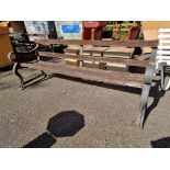 An old cast iron garden bench, having wooden slats, 183cm wide.