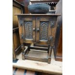 A small reproduction carved oak side cabinet, 50.5cm wide.