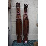 A pair of carved and stained pine figures of a King and Queen, possibly Spanish, 62.5cm high.