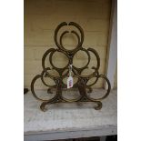 An old brass six bottle wine rack.