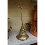 An antique brass doorstop, 41cm high.