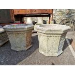 A pair of stone garden pots, 40cm wide.