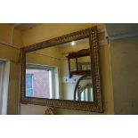 A reproduction gilt framed rectangular wall mirror, 75.5 x 106.5cm.