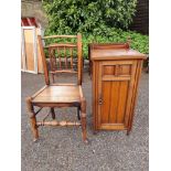 An antique elm side chair; together with a bedside cupboard, 77cm high x 38cm wide.
