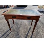 An antique oak side table, having leather top, 72cm high x 92cm wide.