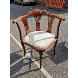 An Edwardian mahogany and inlaid salon occasional chair.