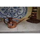 A small copper and brass watering can, by Haws, 34cm long.