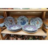 A collection of oriental plates, to include a pair of Chinese Imari examples, (s.d). (9)