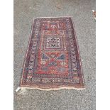 A Persian rug, having central square medallion, with geometric borders, 176 x 100cm.