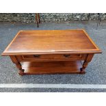 A modern oak coffee table, having one drawer, 46cm high x 100cm wide.