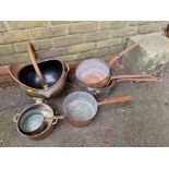 A quantity of old copper saucepans, together with a coal scuttle.