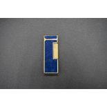 A vintage Dunhill blue lapis 'Rollagas' lighter, 6.5cm high.