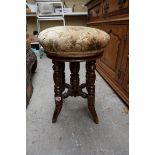 A late Victorian mahogany adjustable piano stool.