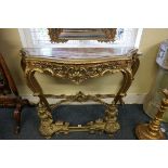 A Louis XV style giltwood and marble top console table, 142cm wide.