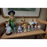 A collection of Chinese pottery and porcelain figures, largest 34cm high. (12)