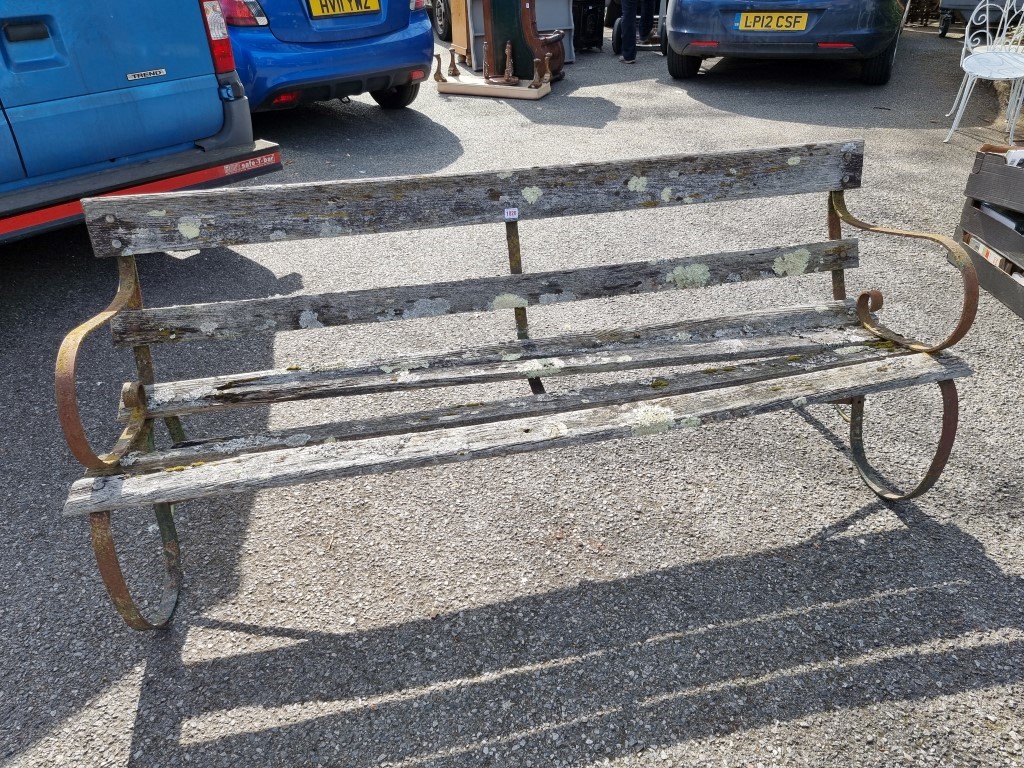 An old iron framed garden bench, 183cm wide.