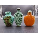 Three Chinese snuff bottles, 19th century, comprising a carved turquoise example, 6cm high (with