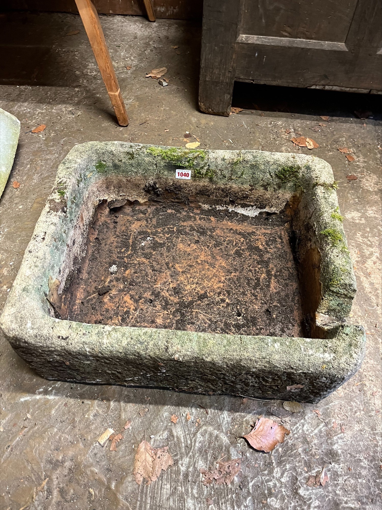 A stone basin, 54cm wide.