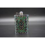 An Islamic champleve enamel hip flask, stamped '92.5', with stylized floral decoration, 14cm high.