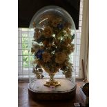 An old silk floral display, under a glass dome, total height 58cm.