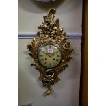 A vintage Swedish rococo style giltwood wall clock, the 6 1/2in dial inscribed 'Westerstrand,