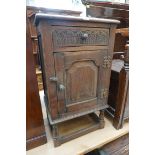 A reproduction oak bedside cupboard, 43cm wide.