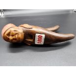 A novelty carved wood figural nutcracker, 20cm long.