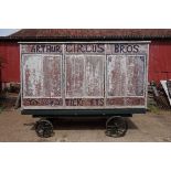 An early 20th century aluminium circus wagon, on four wheel base, 300cm long x 137.5cm wide x