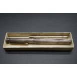 A Sheaffer silver plated engine turned fountain pen, with 14k nib; together with a sterling silver