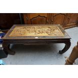 A Chinese carved hardwood opium table, 100cm wide.