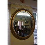 A Victorian gilt framed oval wall mirror, 93 x 81.5cm.