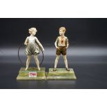 Ferdinand Preiss, 'Hoop Girl and 'Sonny Boy', a pair of ivory and cold painted bronze figures,