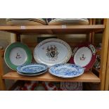 Three 19th century English porcelain armorial plates, largest 35.5cm wide; together with a pair of